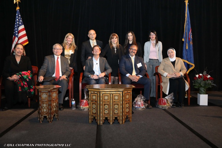 image of previous conference and panelist. 
